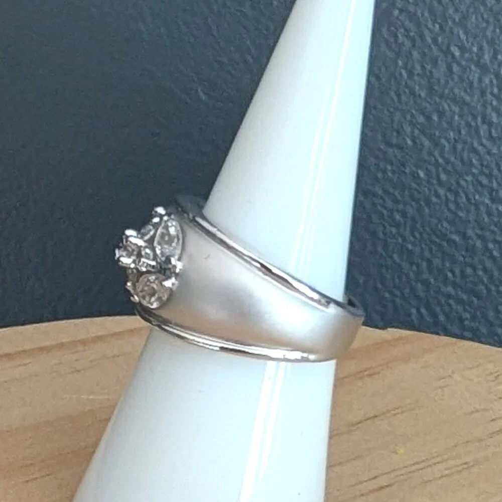 Matte brushed silver tone and faux diamond wide band ring